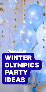 Winter Olympics party photo props selfie station with blue balloons, stars and snowflakes