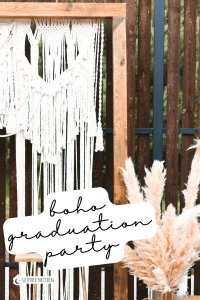 boho graduation party photo selfie station with macrame backdrop and pampas grass