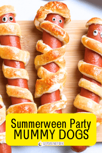 Mummy hot dogs for Summerween party foods for a summer party buffet with text on top