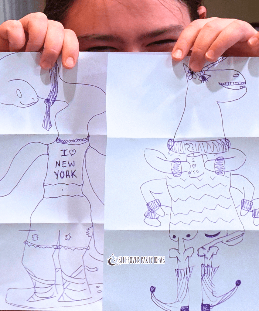Exquisite Corpse Drawing Game for Halloween Halloween drawing game for DIY Halloween party - paper monsters with a party guest holding up the Halloween drawings